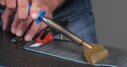Ski touring skins being scraped